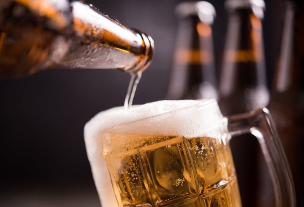 glass-bottles-of-beer-with-glass-and-ice-on-dark-background-AMq2r1ZevLTML069